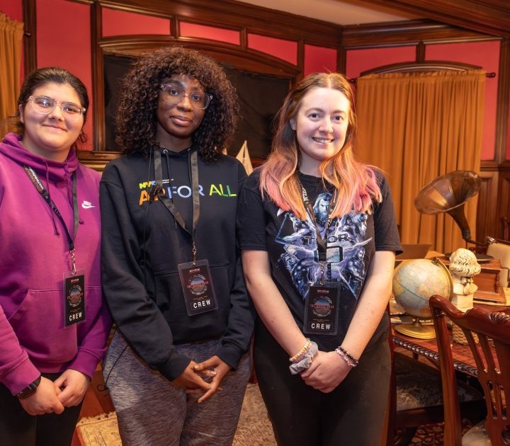 Three female students on film set of The Wrong Road