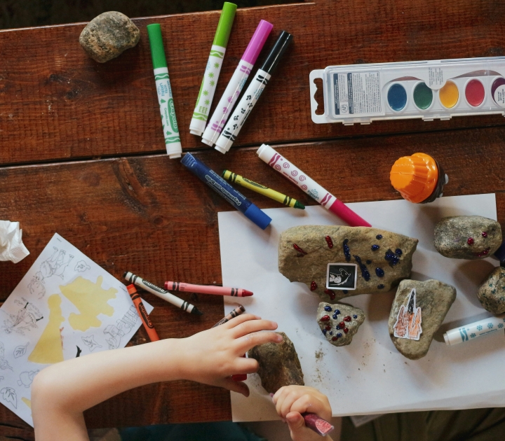 Child working on art project with Crayola products