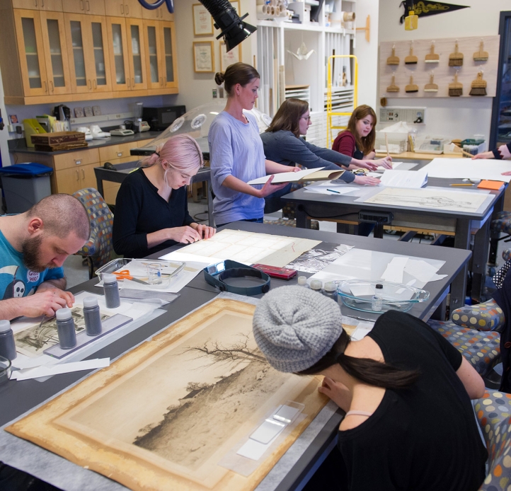 Art conservation students working in a lab