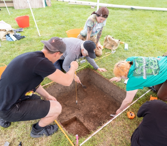 Students excavating an area of land