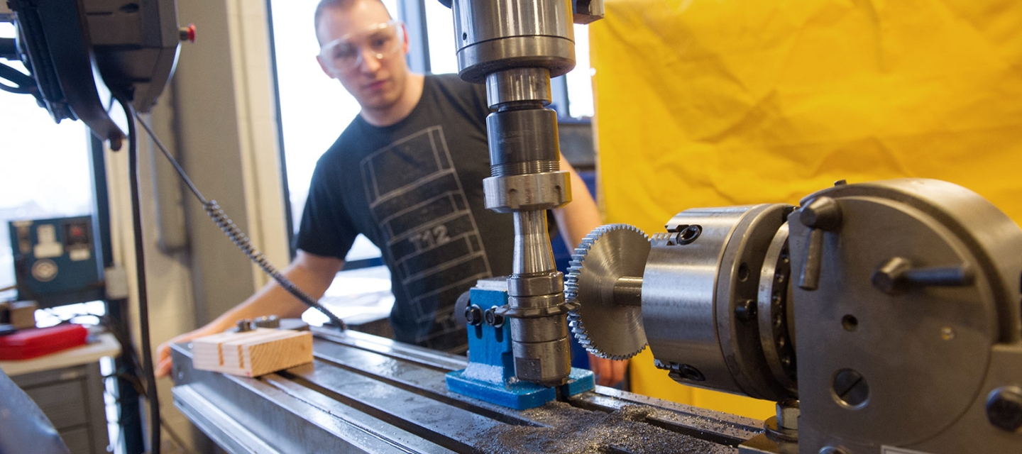 Student using equipment in engineering studio 