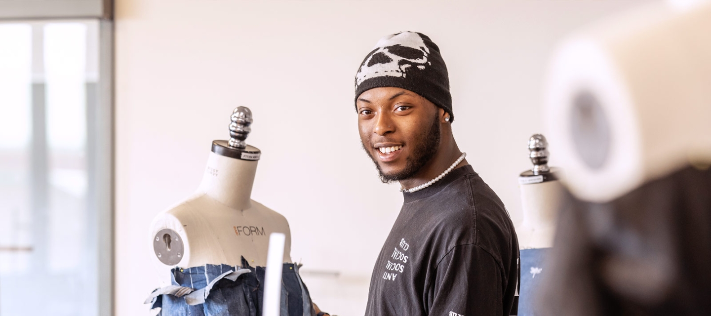 Fashion student working with a dress form